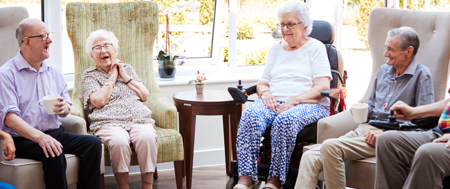 Group Of Seniors Sitting And Talking Together