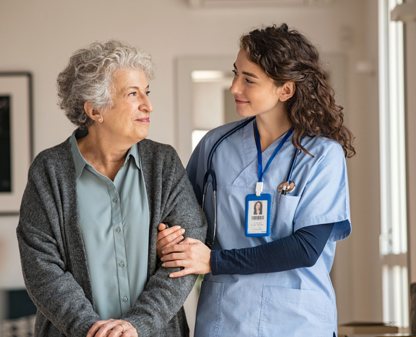 A Senior And A Worker Walking Together