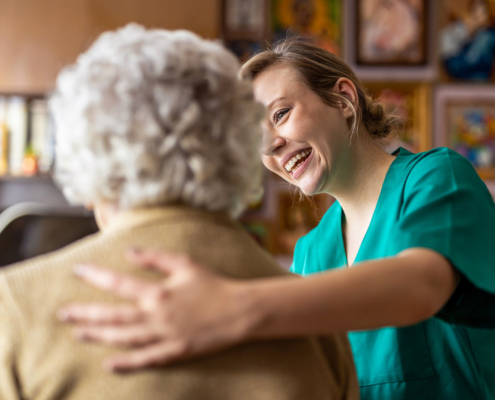 Smiling Nurse Talking To Assited Living Resident