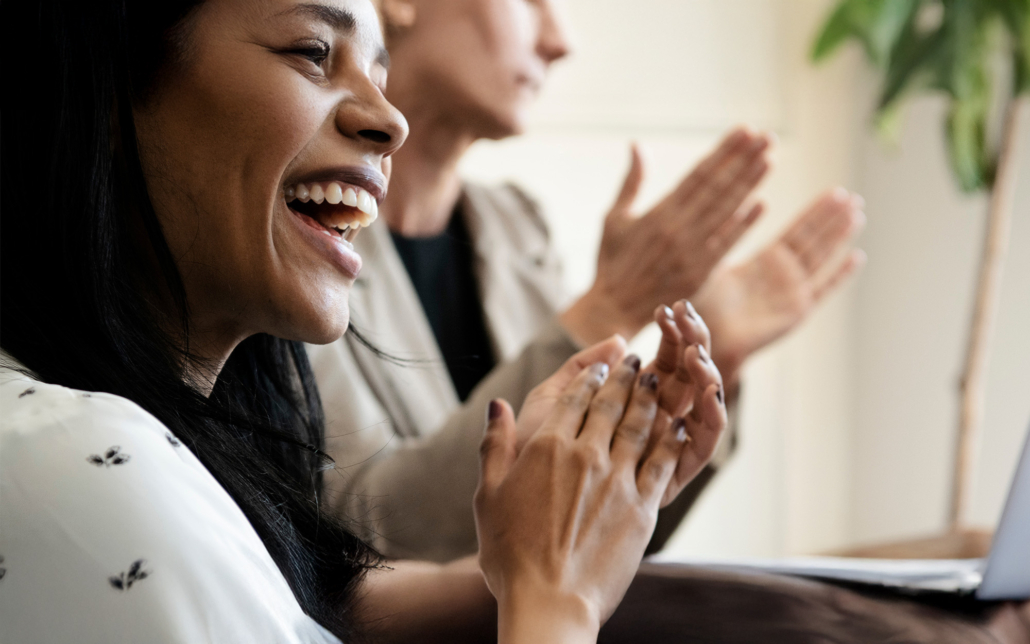 Happy Business People Clapping In The Conference Room