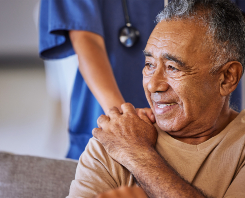 Nurse Or Doctor Give Man Support During Recovery Or Loss