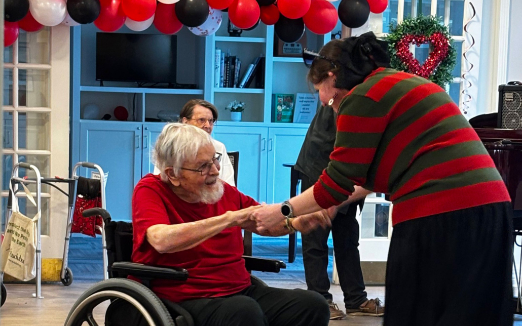 Caretaker Dancing With Loved One In Wheelchair For Valentines Day