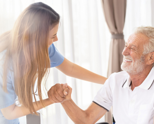 Man Being Cared For By A Private Nurse At Home