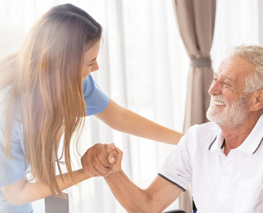 Man Being Cared For By A Private Nurse At Home